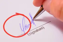 Qué interpreta la grafología cuando una persona firma solo con la inicial